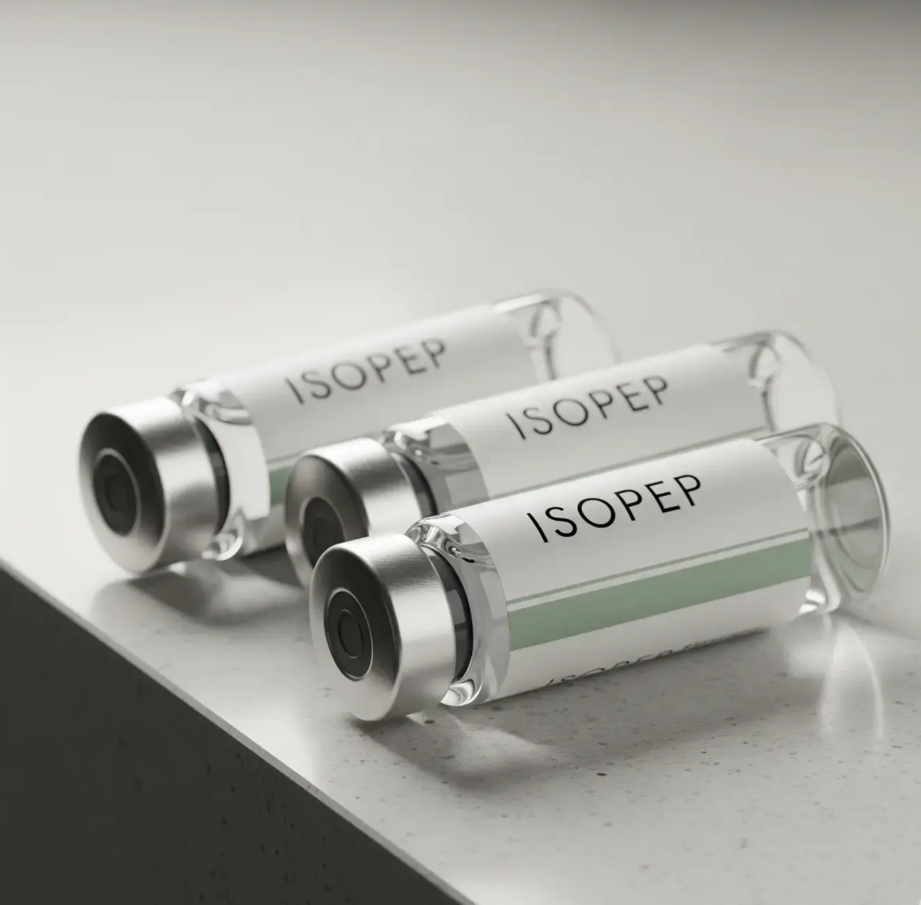 Three ISOPEP ampoules on a clean stone surface